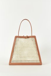 Coral-colored chaîse tour handbag with woven pattern and leather trim.