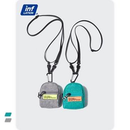 Stylish shoulder bag in grey and blue colors, featuring a compact design with multiple pockets and a detachable strap for versatile wear.