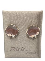  Elegant hoop earrings with round pink gemstones, perfect for adding a touch of sophistication to any outfit.