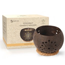 Coconut candle holder with tealight, sustainable, in sunshine design. Made of natural coconut shell with intricate cutout pattern.
