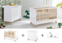 A 3-piece starter set including a cot bed, wide changing unit, and wall shelf in a modern, minimalist design with natural wood accents.