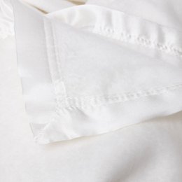Soft, plush, and cozy white blanket available in small, medium, and large sizes.