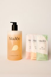Shower gel set in a mix of colors and scents, packaged in a minimalist white box and bottle.