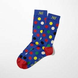 Green and yellow socks with abstract pattern design.