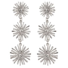 Sparkling silver-tone statement earrings featuring a starburst design with clear crystals. Elegant and eye-catching accessory for formal or special occasions.
