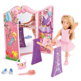 A pink and purple ballet-themed playset with a doll, accessories, and a mirror. The playset includes a ballerina doll wearing a pink tutu and ballet shoes, as well as accessories like a hairbrush and ballet slippers.