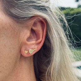  "Diamond Cut Bar Stud Earrings: These gold-toned stud earrings feature a diamond-cut bar design, adding a touch of elegance to any outfit."