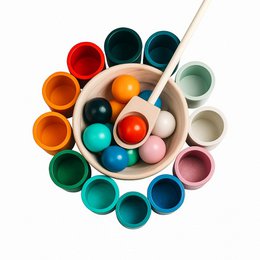  Colorful wooden sorting game with various shapes and colors. Includes round, oval, and cylindrical wooden pieces in a variety of vibrant hues.