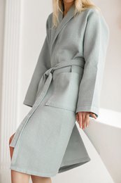 Soft, plush sea green bathrobe with a wrap-around design and a self-tie belt for a comfortable and relaxed fit. Made from high-quality materials for a luxurious feel.