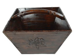 Rectangular wooden container with carved floral design, suitable for storing or transporting rice.