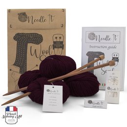 Burgundy knitting kit with needles and wool for a scarf. Includes all the essentials for a beginner to learn knitting.