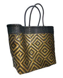 Handmade tote bag with intricate diamond pattern in shades of gold and black.