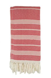 A red and white striped hammam towel with tassels along the edges.