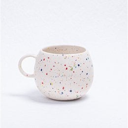 A white ceramic mug with a speckled pattern, featuring a round, tall shape and a handle. The mug is suitable for parties and events.