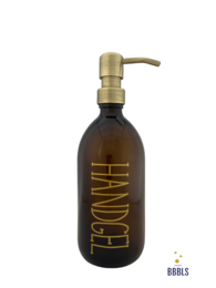 A brown glass soap dispenser with a gold-colored pump and the text "Handgel" printed on the bottle. The dispenser has a capacity of 500ml.