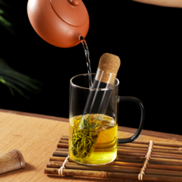 Glass tea infuser with cork stopper, available in 2 sizes, for steeping loose leaf tea. Features a glass body and cork stopper.