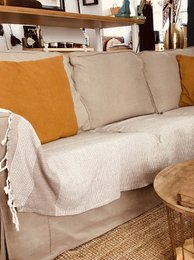 A couch/sofa cover and throw blanket in a variety of neutral colors including beige, grey, black, silver, latte, burgundy, forest green, pink, navy blue, and blue. The product is made of a soft, durable material and measures 150x200 cm (59"x78").