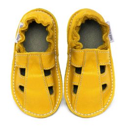 Leather summer slippers in a vibrant yellow color. Features a comfortable, open design with a textured sole for traction. Suitable for casual wear during the warm weather season.