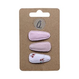  A set of 3 pink and dusty pink hair clips with a floral print design. The clips are suitable for babies and young children.