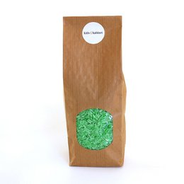 Playing rice green mix (500 grams), a sensory toy with a vibrant green color and irregular shapes, suitable for tactile exploration and sensory play.