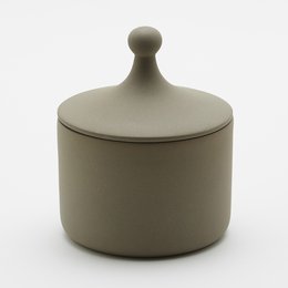 Matte gray ceramic storage jar with a rounded lid. Suitable for storing candies, cookies, or other small items.