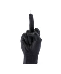 A black candle in the shape of a raised middle finger, packaged in a minimalist white box.