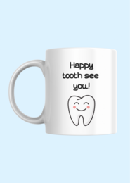 A white ceramic mug with a simple line drawing of a smiling tooth and the text "Happy tooth see you!" printed on it. The mug appears to be a humorous or playful design, likely intended for use as a coffee or tea cup.