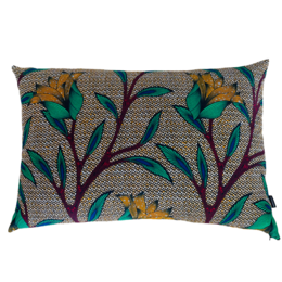 Large, colorful floral cushion with vibrant leaves and flowers in shades of green, yellow, and burgundy on a neutral background.