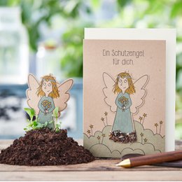 A whimsical guardian angel figurine with a seed plug card, perfect for friendship and encouragement.