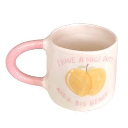 Ceramic mug with pink or green handle, yellow apple illustration, "I have a nice butt" text print