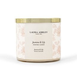 Jasmine & Lily scented candle by Laura Ashley. A tall, round candle with a floral jasmine and lily fragrance. The candle is packaged in a glass container with a gold lid.