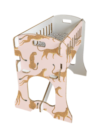 A pink and white baby crib with a leopard print pattern, designed for a child's room.
