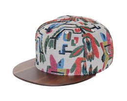 Colorful patterned cap with a wooden brim, featuring a floral and abstract design in various hues. The cap has a snapback closure for adjustable fit.