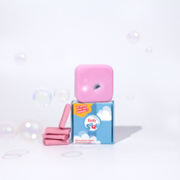 Kindy Mini Pink "Soap-surprise" - a hand soap with a fun, playful design featuring a pink dispenser and a box with a cartoon character. The soap is likely scented and may have additional features like moisturizing ingredients.