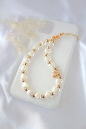 'Elegant 18K custom initial heart pearls beaded lanyard in a variety of sizes. Features a delicate pearl and gold-tone design.'