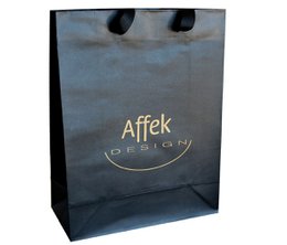 A medium-sized decorative gift bag with the Affek logo printed on it. The bag has a matte black finish and measures approximately 25 x 34 x 8.5 inches.