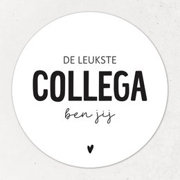 A round magnet with the text "De leukste collega ben jij" (The nicest colleague is you) in black text on a white background.