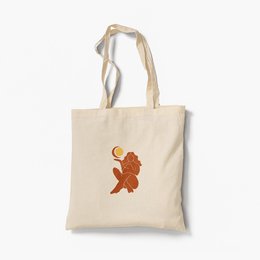Organic tote bag featuring a sun and moon design with a woman silhouette. Made of durable cotton canvas with long handles for comfortable carrying.