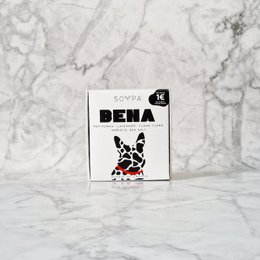 Rectangular soap bar with a black and white graphic design featuring a dog or animal silhouette. The soap is labeled "BENA" and contains the scents of petitgrain, lavender, and ylang ylang.