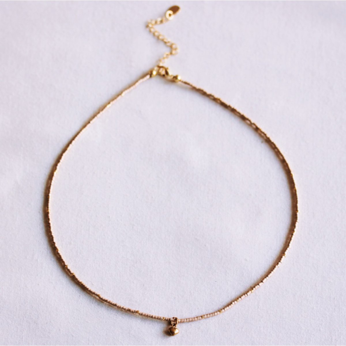 Miyuki necklace with mini heart – bronze/goldplated