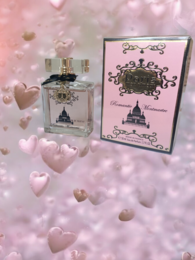 Romantic Montmartre perfume in a 50 ml bottle, featuring a classic Parisian design with a pink and black color scheme. The perfume has a floral, feminine scent.