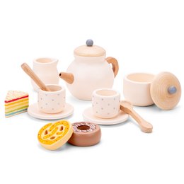 A wooden tea set with a teapot, cups, and various accessories. The set includes a round teapot with a wooden lid, two cups, a saucer, and a wooden spoon. The accessories include a slice of cake and a round cookie or biscuit.