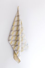 A rectangular tea towel with a geometric diamond pattern in shades of yellow and white. The towel appears to be made of a soft, absorbent material and would be suitable for drying dishes or hands in a kitchen.