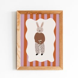 A framed poster featuring a rabbit-like character with a heart-shaped body, set against a striped background. The poster appears to be designed for a nursery or child's room.