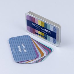 Colorful mood cards in a compact case, designed for couples to promote gratitude, mindfulness, and wellbeing.