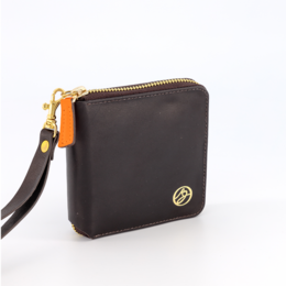 Compact brown leather wallet with orange zipper and gold-tone hardware. Features multiple card slots and a zippered compartment for coins or bills.