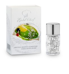 Silver edible crumbs in a salt shaker-style container, used as a food coloring. The container has a decorative design and is packaged in a box.