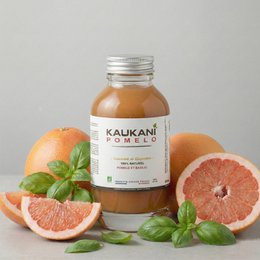 Kaukani Pomelo 250ml juice, a refreshing citrus beverage with a vibrant orange-yellow color and a sweet, tangy flavor.