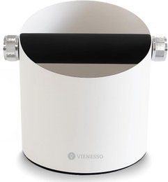  Stainless steel espresso machine with a sleek, modern design. Features a black and white color scheme, a round shape, and a portafilter for brewing espresso.