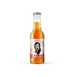 Mango and passion fruit flavored kombucha in a glass bottle with a label featuring a woman's portrait.